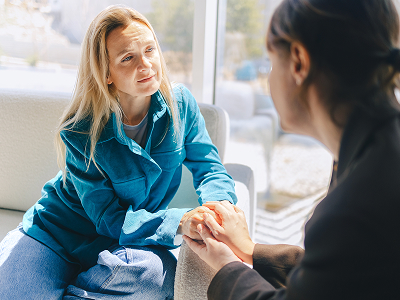 Two women talking as part of the Hizentra Patient Advocate program