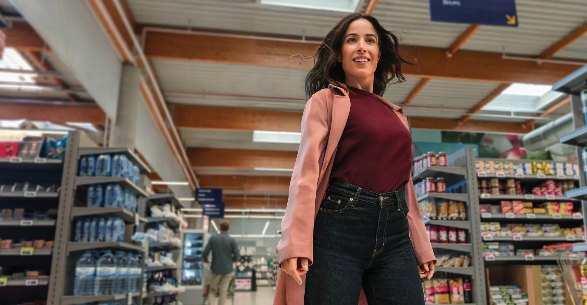 Confident woman walking proudly in a grocery store