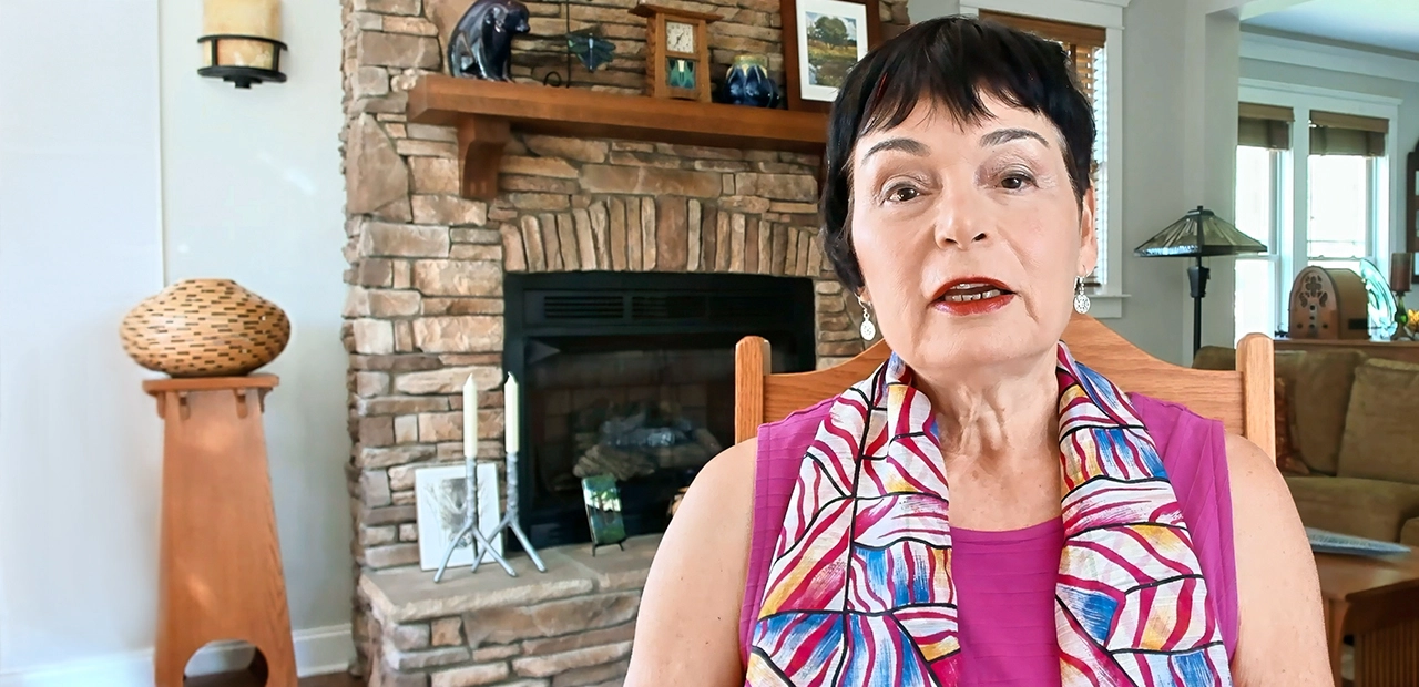 Lynne, a Hizentra patient advocate, sitting in her living room