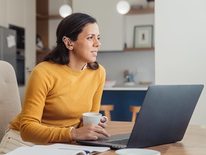 Woman sitting in front of a laptop